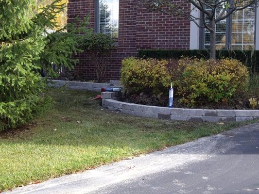 Shelby Township residence after installation of landscaping and retaining wall
