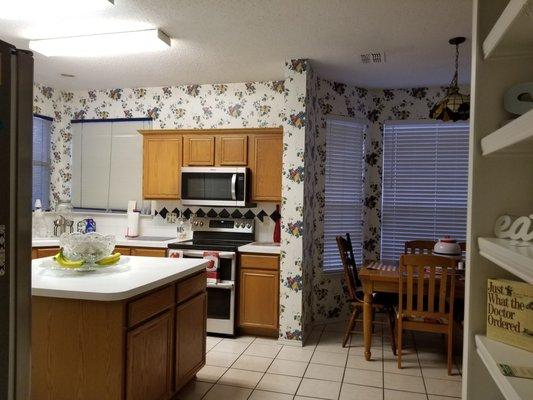 The kitchen is fully equip with dishes, glasses, warmers, pots, pans, silverware and drink pictures etc...