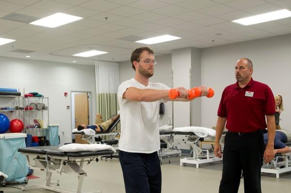 A Ryan Center patient in the main physical therapy room.