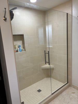 Bathtub was replaced with a tile shower. Marble flooring is original with new grout to match tile in shower.