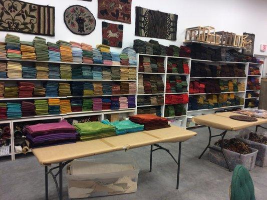 Thousands of pieces of hand dyed wool and over 500 patterns.