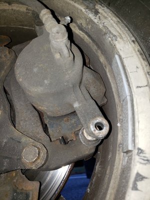 Missing bolt from left caliper that was causing noise