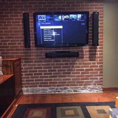 50" TV mounted on Brick wall with 3 Monitor Audio Radius speakers