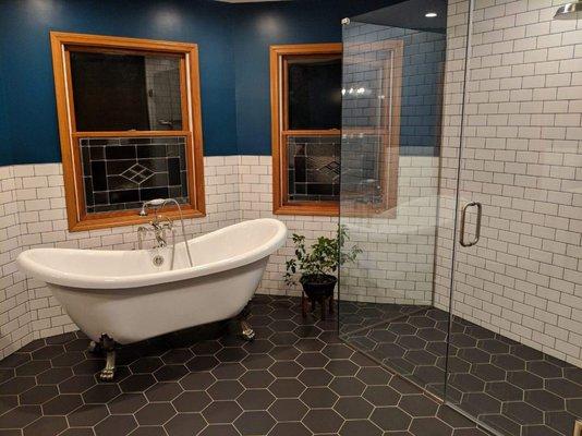 Hexagon floor and custom shower. Subway tiles walls