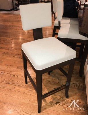 Barstools custom made for a customer to match existing side chairs. Solid walnut frame with exposed apron and tapered curved legs.