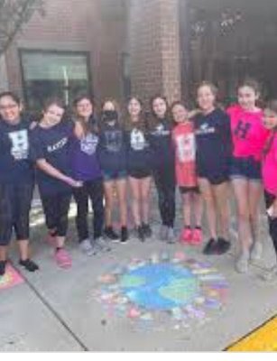 During the hard times, students at Hartford helped the community by doing chalk outside the school.