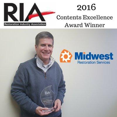 Jim Hall holding the 2016 RIA Contents Excellence Award