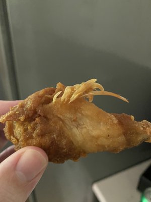 Chicken wings, complete with feathers...