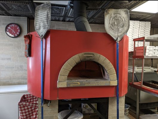 A beautiful well cared for wood oven pizza