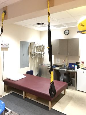 One of the treatment beds. No the black rope is not a swing, but another tool used in the therapy