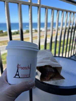 Enjoying my matcha latte and croissant