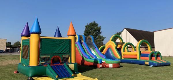 Castle moonwalk, 16 slide, and 53' obstacle course