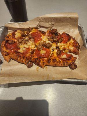 Pineapple pepperoni sausage pizza with a root beer