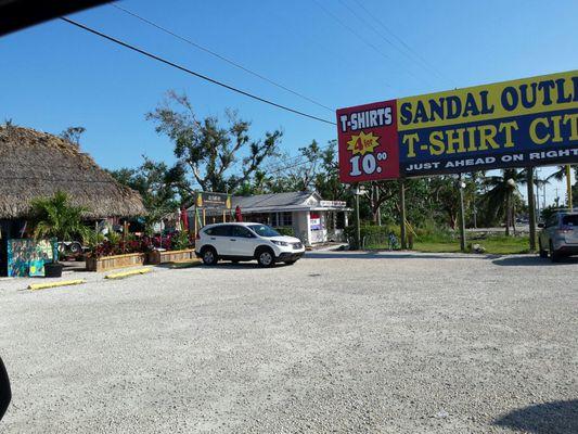 In the same parking lot as Irie Island Eats and the fruit/vegetable stand. Next to Barracuda Grill.