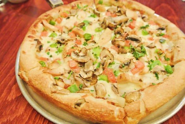 BBQ Chicken Pizza - BBQ sauce, grilled chicken, red onions, green peppers, tomatoes, and mushrooms