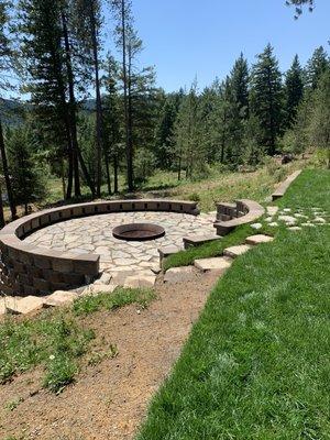 Elevated circular slate patio built into a hillside