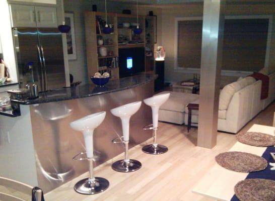 Custom stainless steel column wrap along with stainless steel on breakfast bar for contemporary shore house