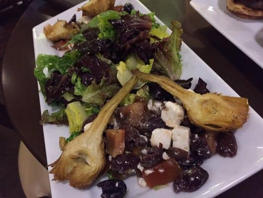 Fried artichoke hearts on salad. Tasty.