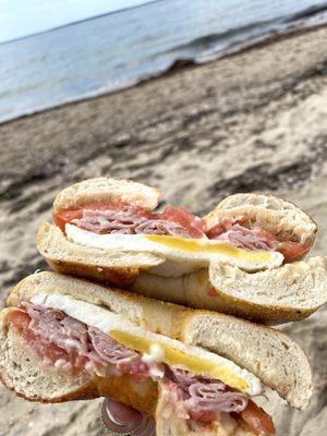 Ham, egg, tomato, & cheese on asiago bagel