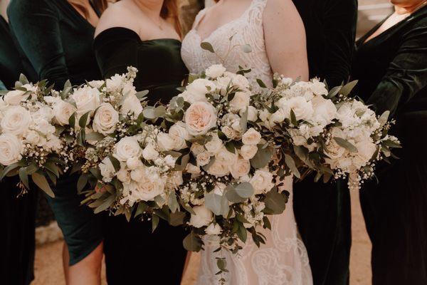 Cascading bouquet for bride and medium bouquets for bridesmaids