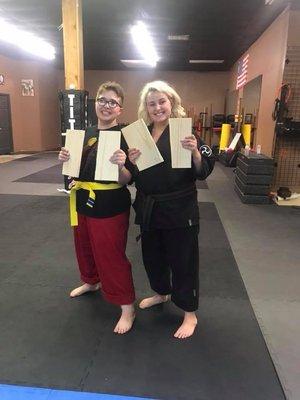 Gabby and Kara both proud of breaking their boards.