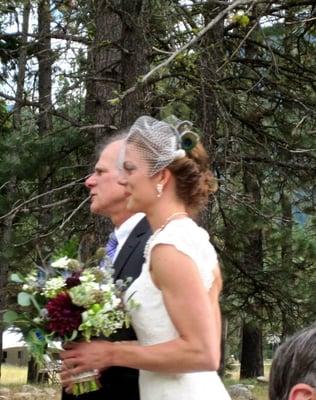 Side view of the updo with birdcage veil.