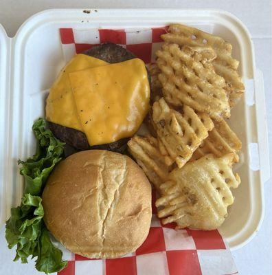 Cheeseburger and waffle fries, to go.