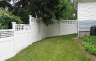 This Main st, and Linden dr. fence in Cohasset also reduces wind load with a larger lattice topper.