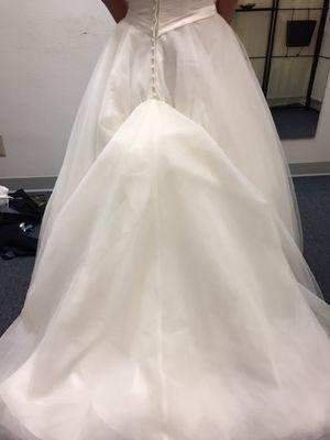 Ezzat added a 3-part bustle to my wedding dress as one bustle wasn't enough. She did a great job!