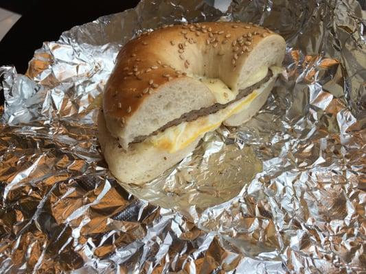 Sausage, egg, and cheese on a sesame seed bagel