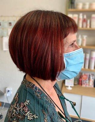 A graduated bob with cool red partial balayage.