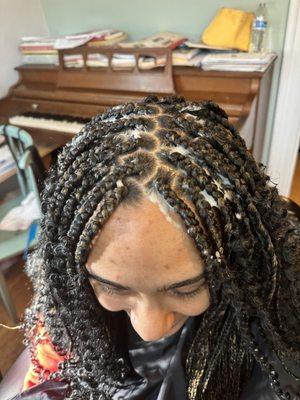 Box braids with curly part