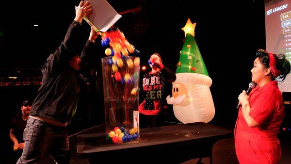 Contestants compete in a wild physical challenge during 100 League's holiday show Elf Rebellion at Two Bit Circus in LA.