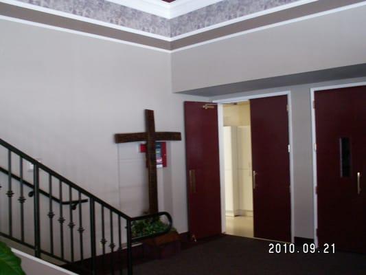 Kitchen/stairs to classrooms from foyer