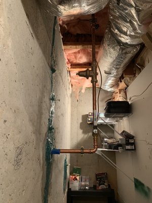 Water service leak at foundation of home