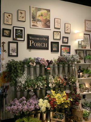 We carry a large variety of floral stems, as well as containers. We also have a large selection of wall decor including local art.