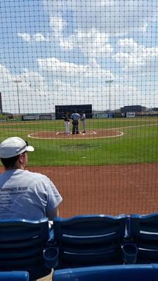 Three rows up from homeplate.