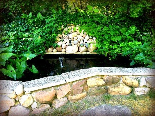 Off of the back deck we have a Coy pond and a seated rim to relax and listen to the water trickle.