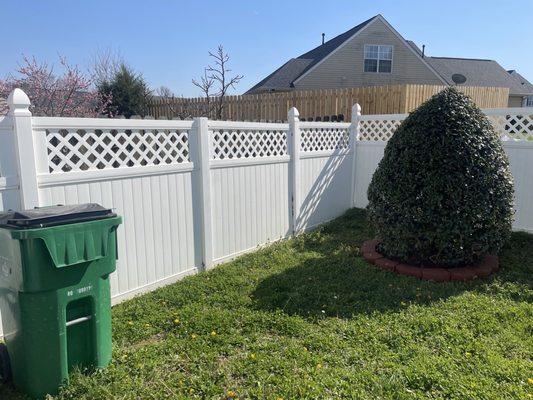 Power washed white fence.