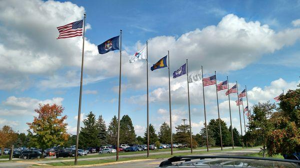 Flags out front! Very kum-by-ya! Let's hold hands and sing!