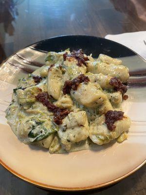 Ricotta cheese gnocchi with bacon, spinach and Parmesan cheese shaved on top! Fabulous