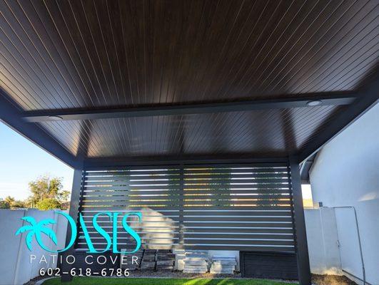 Custom 4K Aluminum installatiom using our shiplap style insulated wood grain roof panels.