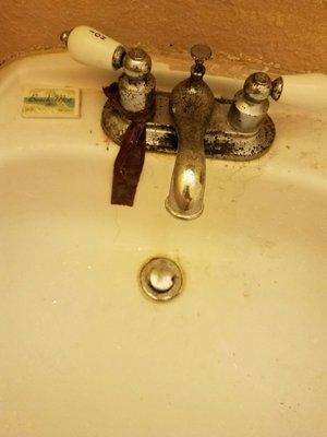 Faucet is cracked water with leaking and handle for hot water does not work.