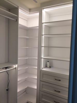 White closet with led lighting