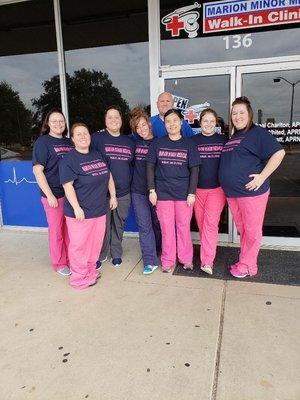 Staff in front of building