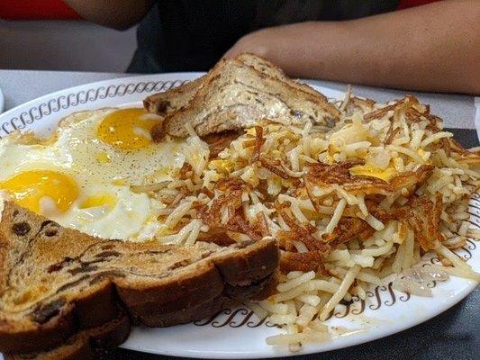 Eggs raisin bread and hash browns