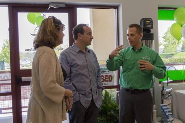 Ellicott City location owner, Bryan Pax, explains water filtration to customers.