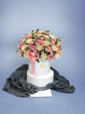 Pink and white roses in a vase