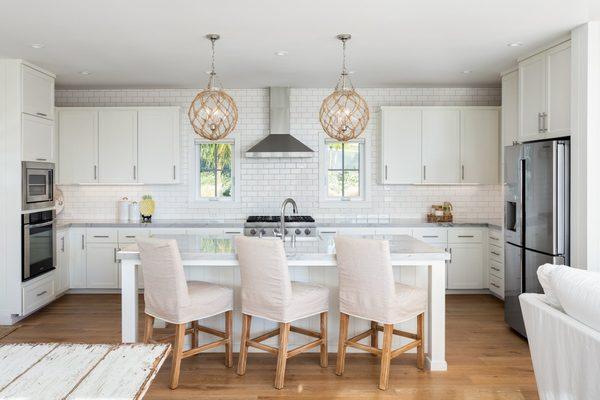 Stained kitchen cabinets and painted walls, ceiling, and trim.