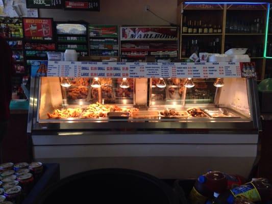 The food spread of fried goodies, gumbo, boudin, and boiled seafood.